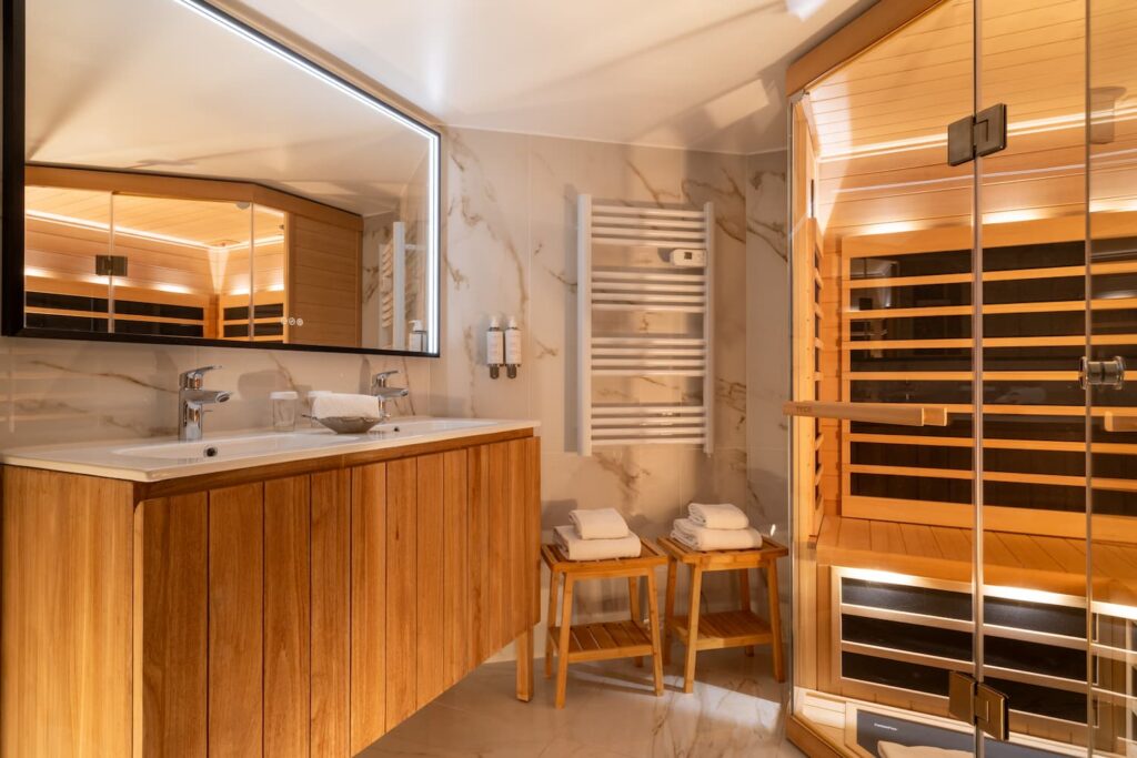 bathroom with a sauna and wooden furniture | romantic stay in Paris | hotel de seine Paris very center of Paris